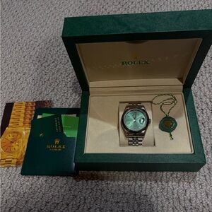 Rolex Men's Silver and Green Dial Watch